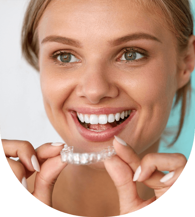 Dental invisible braces or silicone trainer in the hands of a young smiling girl stock image